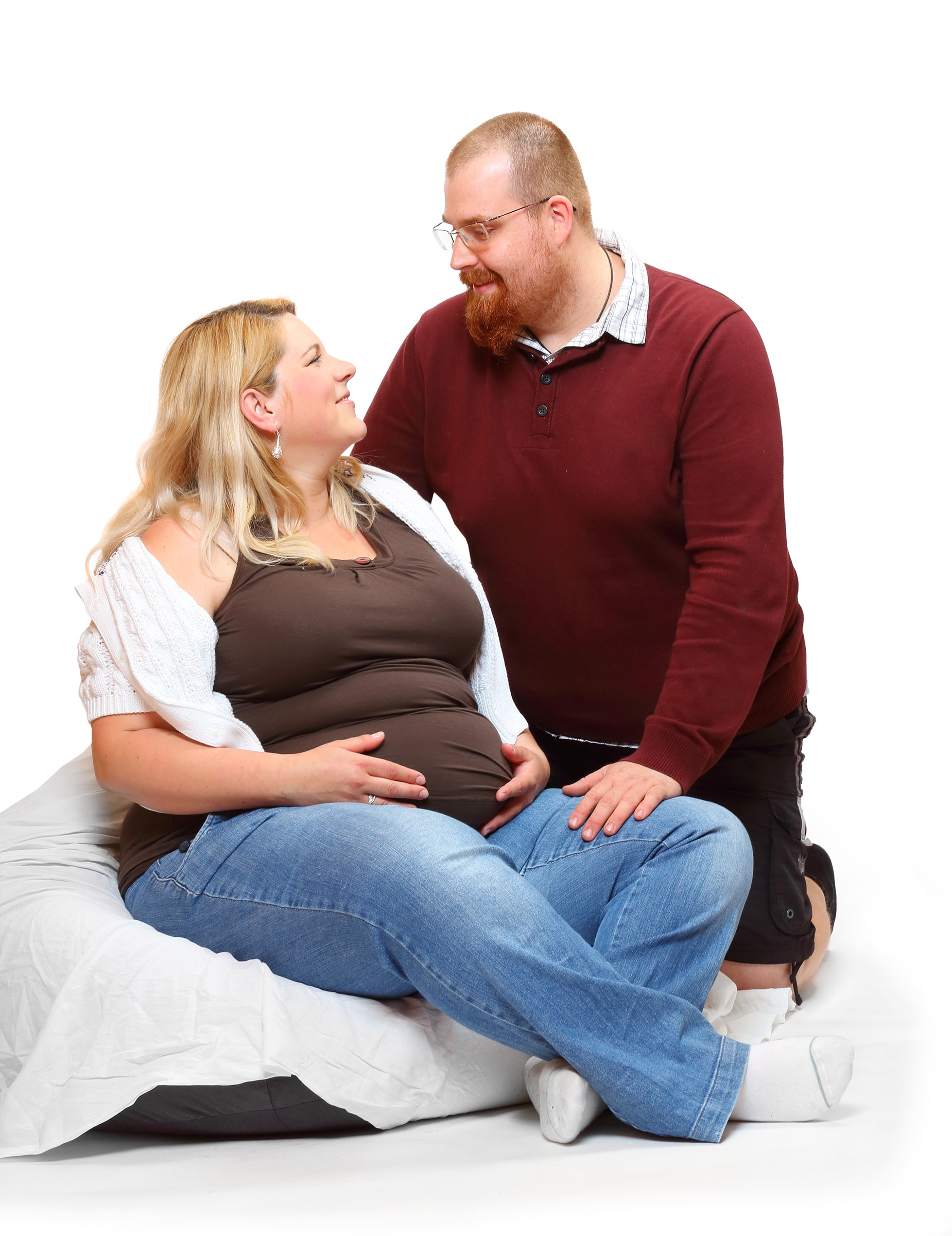 Loving, overweight, expectant couple