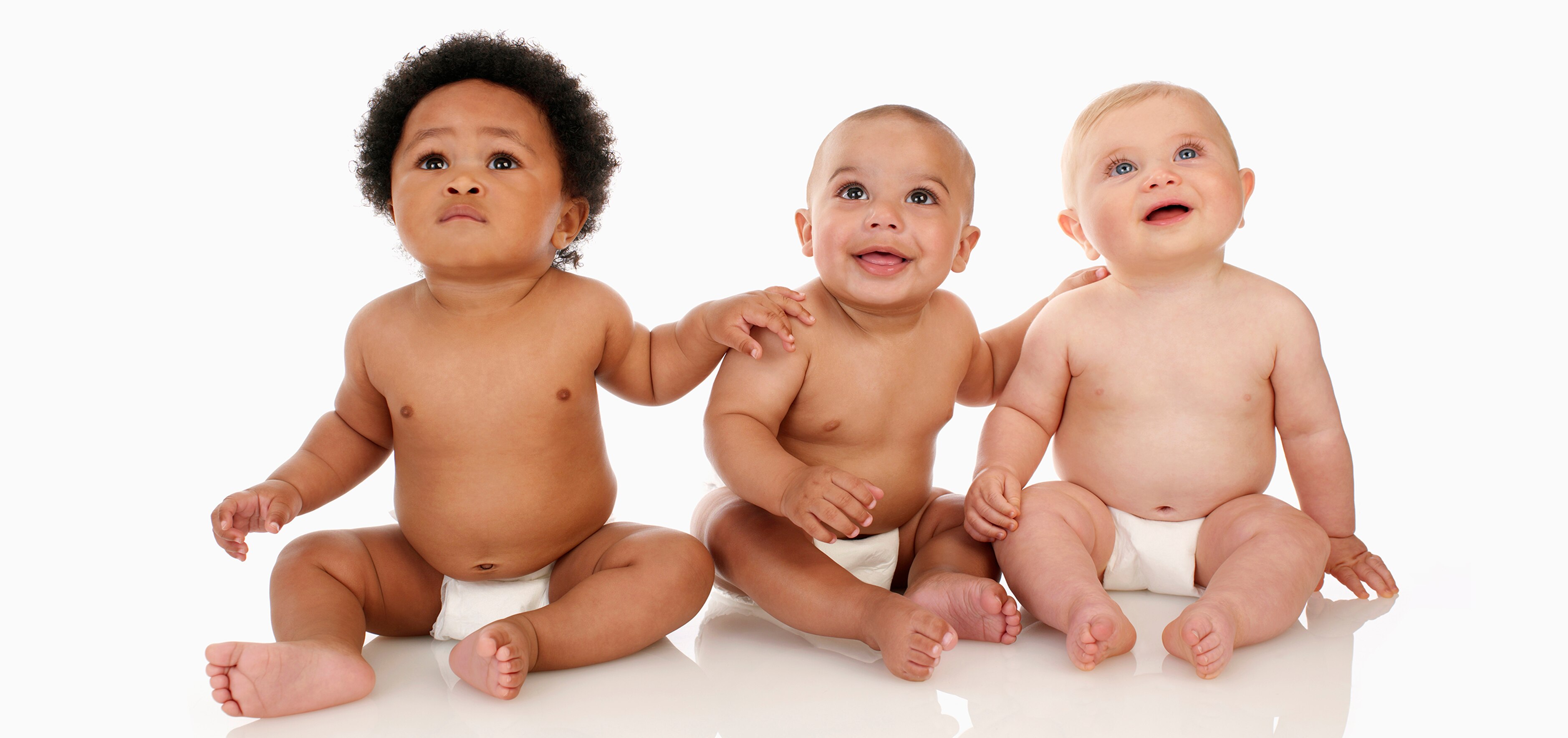 Three happy, ethnically diverse babies